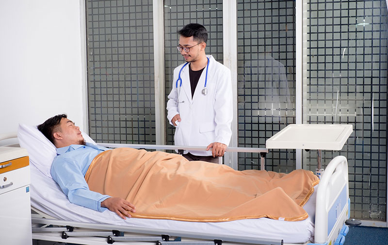 doctor making a medical visit to check up on a patient