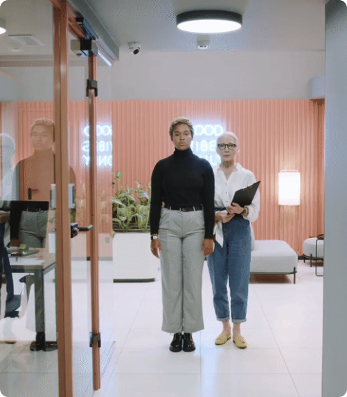 Two women walking down the hallway